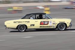 Shot of Lynda Jacobs behind the wheel of Wimpy on the autocross at OUSCI 2017